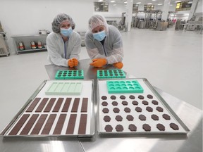 Canopy Growth Corp. in Smith's Falls Wednesday Oct. 16, 2019. New Hummingbird Chocolate production line. Hummingbird Chocolate owners Erica and Drew Gilmour pose with some product Wednesday.