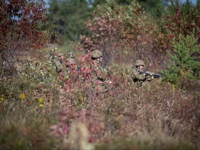 Members from November Company, 3 Royal Canadian Regiment perform section attacks and urban drills as part of trialling for the new potential uniform pattern, Sept. 18 2019.