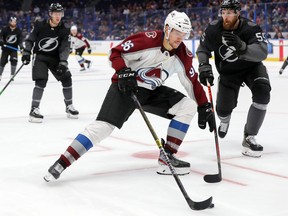 Mikko Rantanen of the Colorado Avalanche skates past Braydon Coburn of the Tampa Bay Lightning during the third period at the Amalie Arena on Oct. 19, 2019 in Tampa, Fla. (Mike Carlson/Getty Images)