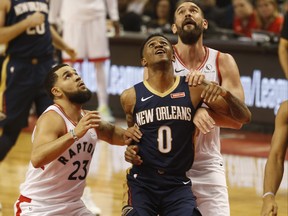 Pelicans’ Nickeil Alexander-Walker (middle) is sandwiched between Raptors’ Fred VanVleet (left) and Marc Gasol during the second quarter at Scotiabank Arena last night.  Jack Boland/Toronto Sun