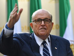 In this file photo taken on Sept. 24, 2019, lawyer Rudy Giuliani speaks to the Organization of Iranian American Communities during their march to urge "recognition of the Iranian people's right for regime change," outside the United Nations Headquarters in New York City.