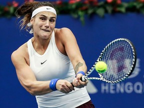 Aryna Sabalenka of Belarus hits a return against Kiki Bertens of the Netherlands in their women's singles final match of the Zhuhai Elite Trophy tennis tournament in Zhuhai, in south China's Guangdong province on Oct. 27, 2019.