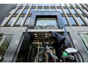 A man cycles past a SNC-Lavalin company building in Montreal, Quebec, Canada, May 5, 2019.