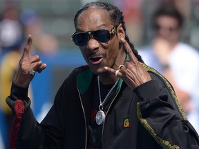 Music artist Snoop Dogg gestures before a game between the Houston Texans and Los Angeles Chargers at Dignity Health Sports Park. (Jake Roth-USA TODAY Sports)