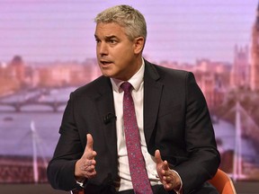 In this handout photograph taken and released by the BBC on October 6, 2019, Britain's Secretary of State for Exiting the European Union (Brexit Minister) Stephen Barclay gestures as he speaks during an appearance on the BBC political programme The Andrew Marr Show in Salford. (JEFF OVERS/BBC/AFP via Getty Images)