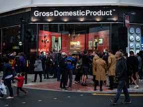 Members of the public queue to look at a new installation by elusive artist Banksy on Oct.1, 2019 in Croydon, England.