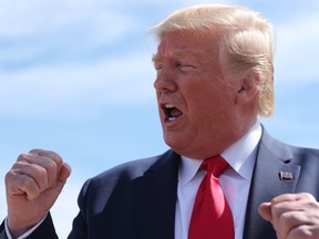 U.S. President Donald Trump talks to reporters about Turkey's agreement to a ceasefire in Syria as he arrives in Dallas, Texas, U.S., October 17, 2019.