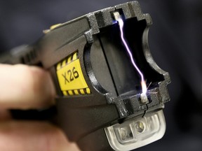 A close up of 50,000 volts arcing between the two terminals of a Taser X26 conductive energy weapon. (Postmedia file photo)