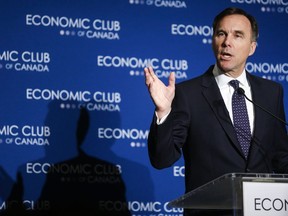 Finance Minister Bill Morneau addresses an Economic Club of Canada breakfast in Calgary, June 19, 2019. The Liberal government expects to get $500 million a year out of the expanded Trans Mountain pipeline and is promising to spend it all on cleaner sources of energy and projects that pull carbon out of the atmosphere.
