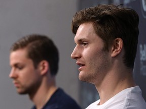 Jacob Trouba (right) answers a question while Josh Morrissey waits during the Winnipeg Jets final media availability at Bell MTS Place in Winnipeg on May 22, 2018. (KEVIN KING/Winnipeg Sun)