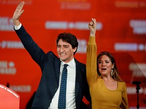 Liberal leader and Canadian Prime Minister Justin Trudeau and his wife Sophie Gregoire Trudeau wave to supporters after the federal election at the Palais des Congres in Montreal October 22, 2019. (REUTERS/Carlo Allegri)