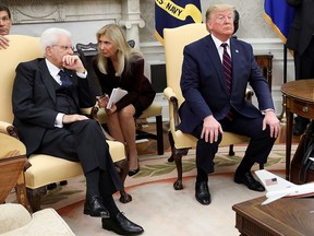 An interpreter speaks with Italy's President Sergio Mattarella as U.S. President Donald Trump dismisses reporters following remarks before their meeting at the White House in Washington, U.S. October 16, 2019. (REUTERS/Jonathan Ernst)