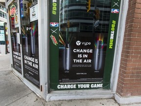 Vaping advertising on the windows of a convenience store in Toronto on Oct. 25, 2019.