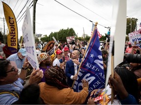 Protesters and supporters of U.S. President Donald Trump clash in front of Benedict College as the president spoke at the 2019 Second Step Presidential Justice Forum at the college in Columbia, South Carolina, U.S. October 25, 2019.