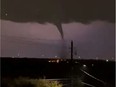 A tornado is seen in North Dallas late Sunday night.