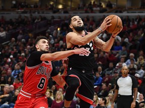 The Toronto Raptors' Fred VanVleet drives against Zach LaVine of the Chicago Bulls on Saturday night at the United Center.