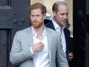 In this file photo taken on May 18, 2018 Britain's Prince Harry and his best man, Prince William, arrive to greet well-wishers on the street outside Windsor Castle in Windsor. (TOLGA AKMEN/AFP via Getty Images)