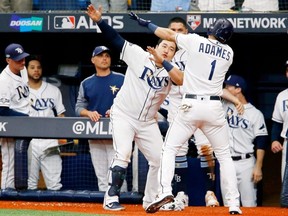 Rays shortstop Willy Adames (1) celebrates his home run against the Astros with first baseman Ji-Man Choi during the sixth inning in Game 3 of the ALDS at Tropicana Field in St. Petersburg, Fla., on Monday, Oct. 7, 2019.