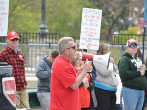 Elementary Teachers Federation of Ontario President Sam Hammond addresses a crowd at a rally outside the constituency office of Bruce-Grey-Owen Sound MPP and Minister of Government and Community Services Bill Walker on Friday in Owen Sound.