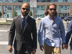 Toronto Police Const Michael Theriault (left with beard) and his brother Christian Theriault (long hair).
