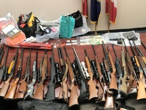 OPP investigators recovered stolen property, including firearms, after a man and woman from Dutton-Dunwich were charged with breaking in to homes in Elgin and Middlesex counties while the owners were at funerals. (OPP photo)