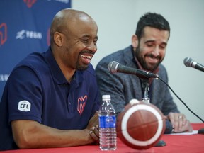 Montreal Alouette President and CEO Patrick Boivin, right, and head coach Khari Jones laugh during their end-of-season press conference on November 15, 2019 in Montreal.