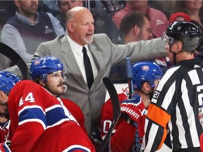 Canadiens coach Claude Julien discusses a penalty call with referee TJ Luxmore during third period of NHL game at the Bell Centre in Montreal against the Ottawa Senators on Nov. 20, 2019.