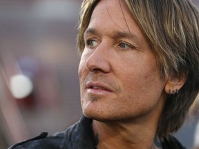 Country music star Keith Urban talks to media in Calgary Saturday, November 23, 2019 at McMahon Stadium. Urban plays at half time during the Grey Cup as The Hamilton Ti Cats take on the Winnipeg Blue Bombers on Sunday. Jim Wells/Postmedia