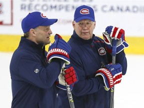 Montreal Canadiens head coach Claude Julien (right) speaks with associate coach Kirk Muller during practice at the Bell Sports Complex in Brossard on Nov. 27, 2019.