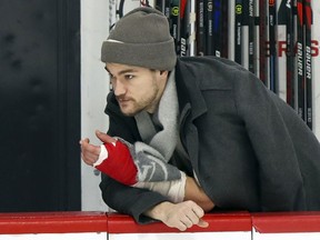 "For me, every morning I try to be in a good mood where I may change one guy's mood and he feels better," injured Canadiens forward Jonathan Drouin says about watching practices from the bench at the Bell Sports Complex in Brossard.