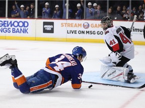 Cole Bardreau of the Islanders is tripped while breaking in alone on Senators netminder Craig Anderson in the second period. Awarded a penalty shot, Bardeau then scored his first NHL goal.