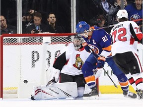 Craig Anderson of the Senator s makes a save against the Islanders during a game on Nov. 5. It was Anderson's last start in goal for the Senators.