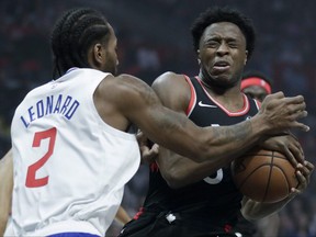 Toronto Raptors forward OG Anunoby reacts after getting hit in the eye by Los Angeles Clippers forward Kawhi Leonard during the  game, Monday, Nov. 11, 2019.
