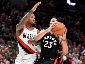 Toronto Raptors guard Fred VanVleet drives to the basket against Portland Trail Blazers guard Damian Lillard during the game on Wednesday, Nov, 13, 2019.