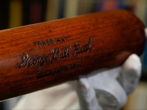 Babe Ruth's 500th home run bat is held by SCP Auctions president David Kohler before it goes up for auction in Laguna Niguel, Calif., Nov. 25, 2019. (REUTERS/Mike Blake)