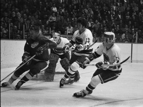 The Vancouver Canucks, unable to get Gilbert Perreault in their first draft, took defenceman Dale Tallon, centre, who had his hands full with Gordie Howe and the Detroit Red Wings at the Pacific Coliseum on Nov. 17, 1970.