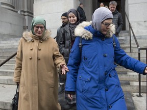 Women wearing hijabs leave the Quebec Court of Appeal in Montreal, Tuesday, Nov. 26, 2019, where members of the National Council of Muslims and the Canadian Civil Liberties Association (CCLA) are challenging Quebec's Bill 21. THE CANADIAN PRESS/Graham Hughes