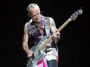 Band membe Flea on stage as the Red Hot Chili Peppers perform at Canadian Tire Centre.