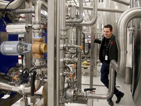 Canopy Growth CEO Mark Zekulin guides a tours through the bottle and chocolate factories at Canopy Growth in Smiths Falls, Ont.