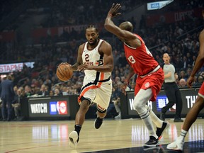 Kawhi Leonard (left) and the Clippers will play host to the Raptors tonight in Los Angeles.  Sean M. Haffey/Getty Images