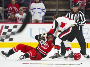 Senators right wing Bobby Ryan fights Carolina Hurricanes left wing Brock McGinn during the first period at PNC Arena.