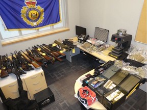 An Ontario Provincial Police handout photo of weapons, including an inert (non-functioning) rocket launcher, am munition and drugs seized during a raid at a Christie Street residence on Thursday.