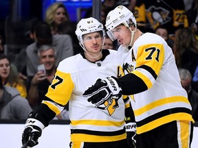 Sidney Crosby and Evgeni Malkin of the Pittsburgh Penguins talk before the faceoff of a power play against the Los Angeles Kings during the third period of a Penguins win at Staples Center on Jan. 18, 2018 in Los Angeles.