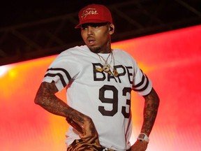 This file photo taken on June 26, 2015 shows singer Chris Brown performing during a free concert in Champ de Mars, downtown Port-au-Prince, Haiti.