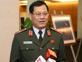 Major General Do Hu Cau, director of police for Nghe An province, speaks to the media, in relation to the 39 migrants found death in a truck in Britain, during a parliamentary break in Hanoi on November 4, 2019. -