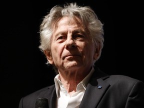 In this file photo taken Nov. 4, 2019, French Polish director Roman Polanski looks on on stage after the preview of his last movie "J'accuse" (An Officer and a Spy) in Paris.