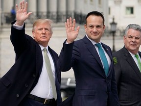 In this file photo taken on March 15, 2018 (L-R)US President Donald Trump,Ireland's Prime Minister Leo Varadkar, and Rep. Peter King(R-NY) leave after the annual Friends of Ireland luncheon on Capitol Hill in Washington, D.C.