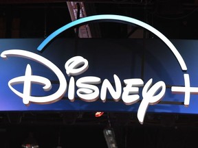 In this file photo taken on August 23, 2019 a Disney+ streaming service sign is pictured at the D23 Expo, billed as the "largest Disney fan event in the world," at the Anaheim Convention Center in Anaheim, California.