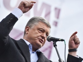 In this file photo taken on April 19, 2019 Ukrainian President and then presidential candidate Petro Poroshenko addresses his supporters during a rally in Kiev hours before a stadium debate with his rival, comedian Volodymyr Zelensky. (SERGEI GAPON/AFP via Getty Images)