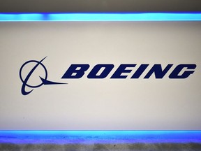 In this file photo taken on October 22, 2019 the Boeing logo is seen during the the 70th annual International Astronautical Congress at the Walter E. Washington Convention Center in Washington, DC.